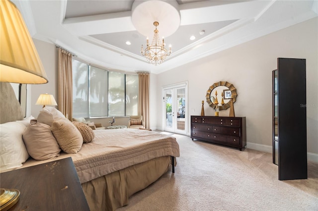 carpeted bedroom with a tray ceiling, access to exterior, crown molding, and an inviting chandelier