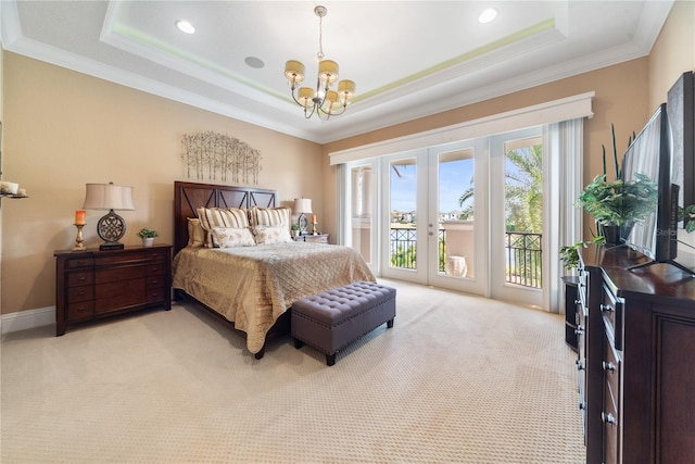 bedroom with light colored carpet, french doors, access to outside, and a tray ceiling