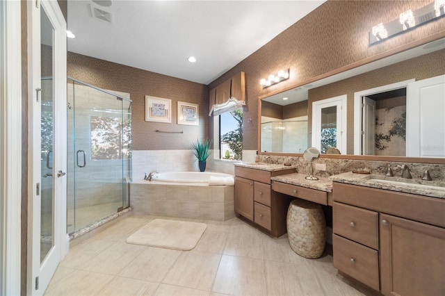 bathroom featuring vanity and separate shower and tub