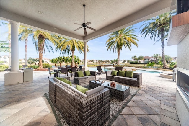 view of patio featuring an outdoor hangout area and ceiling fan