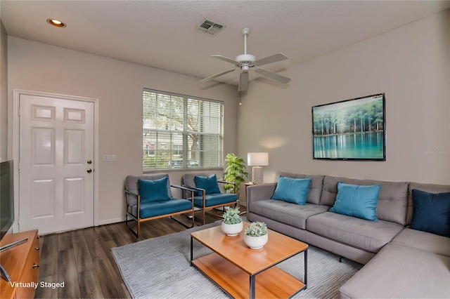 living room with ceiling fan and dark hardwood / wood-style floors