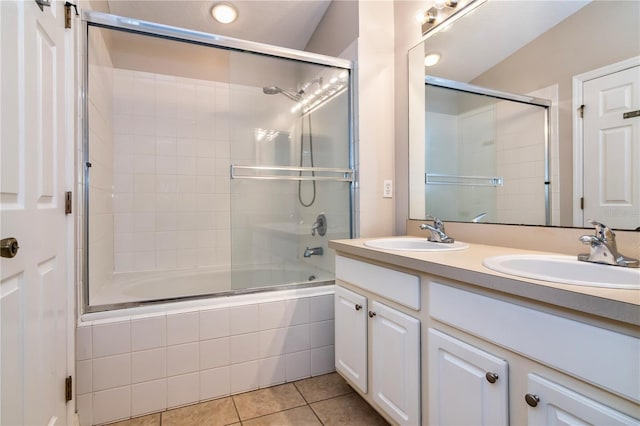 bathroom with vanity, tile patterned flooring, and shower / bath combination with glass door