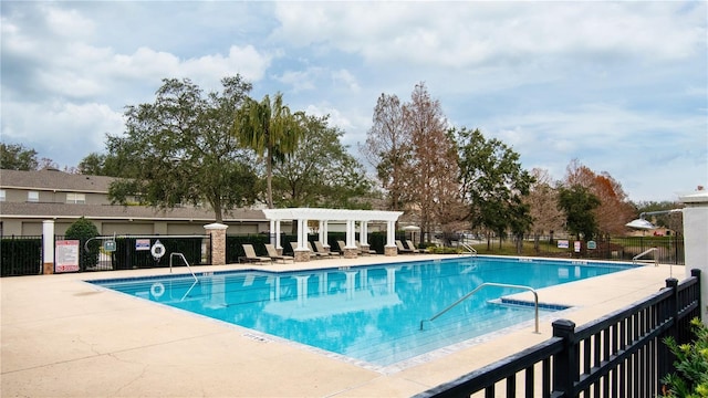 view of swimming pool with a pergola and a patio area