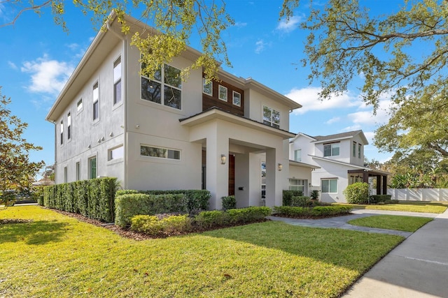 view of front of home with a front lawn