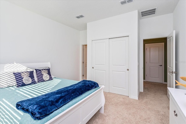 carpeted bedroom with a closet