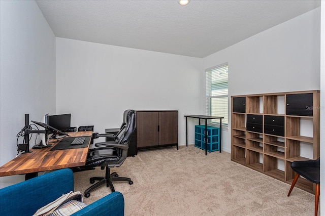 carpeted home office with a textured ceiling