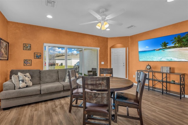 dining room featuring ceiling fan and wood-type flooring