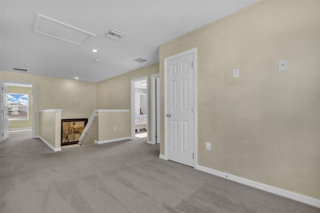 unfurnished room with light colored carpet