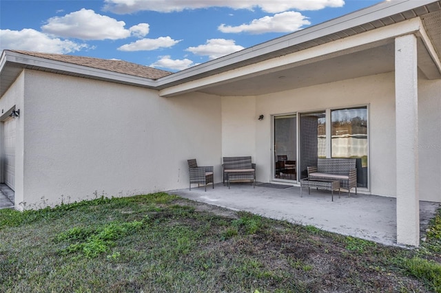 rear view of property featuring a lawn and a patio