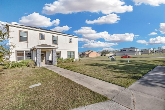 view of front of home featuring a front yard