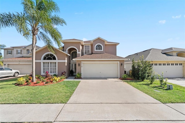 view of front of property with a garage and a front yard