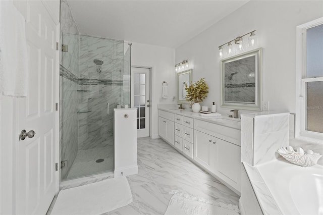 bathroom with vanity and independent shower and bath