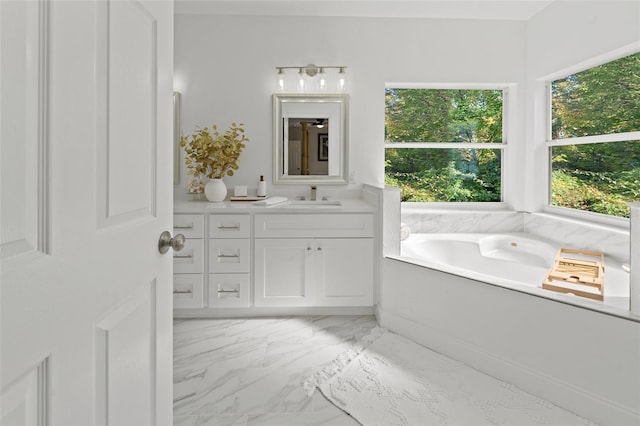 bathroom featuring a tub to relax in and vanity