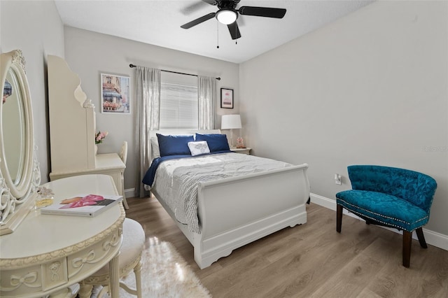 bedroom featuring ceiling fan and hardwood / wood-style floors