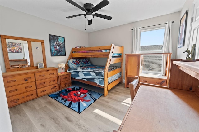 bedroom with ceiling fan and light hardwood / wood-style floors