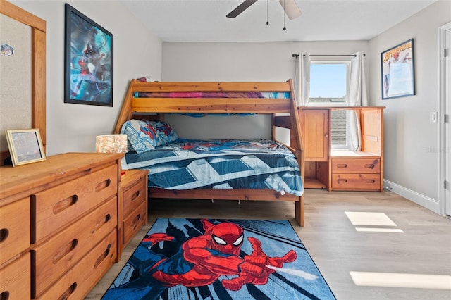 bedroom with ceiling fan and light hardwood / wood-style floors