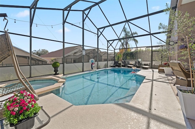 view of swimming pool with an in ground hot tub, glass enclosure, and a patio