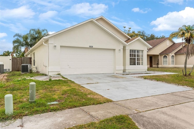 single story home with a front yard, a garage, and central AC unit