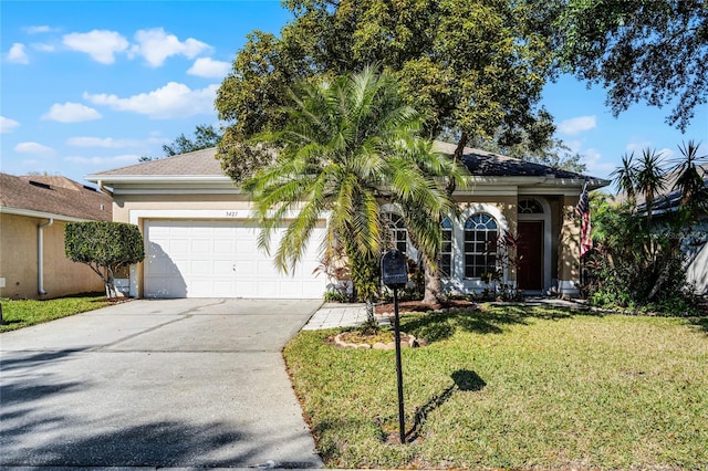 ranch-style home with a front lawn and a garage