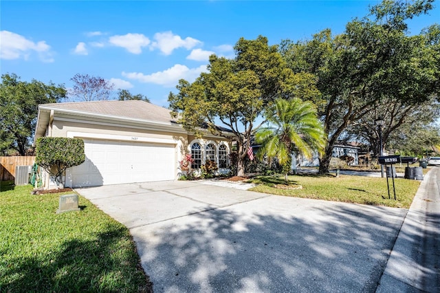 single story home with a front yard and a garage