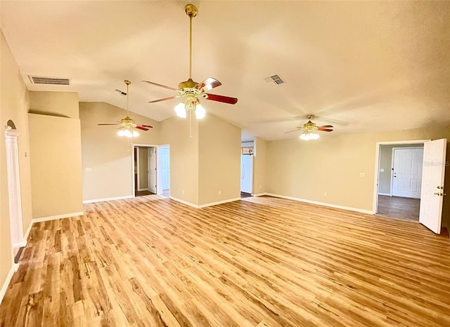 unfurnished living room with light hardwood / wood-style floors and vaulted ceiling