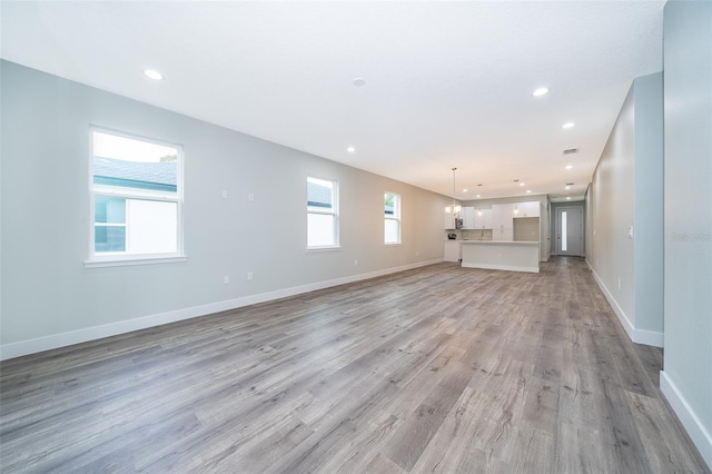 unfurnished living room featuring light hardwood / wood-style flooring