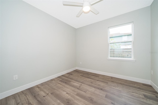 spare room with ceiling fan and light hardwood / wood-style flooring