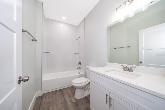 full bathroom with toilet, hardwood / wood-style flooring, shower / bathing tub combination, and vanity