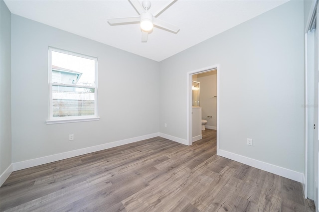 empty room featuring light wood-type flooring and ceiling fan