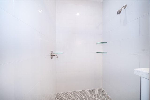 bathroom with tiled shower