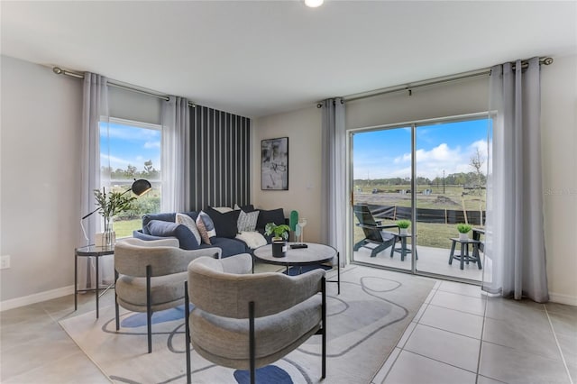 living room featuring plenty of natural light and light tile patterned floors