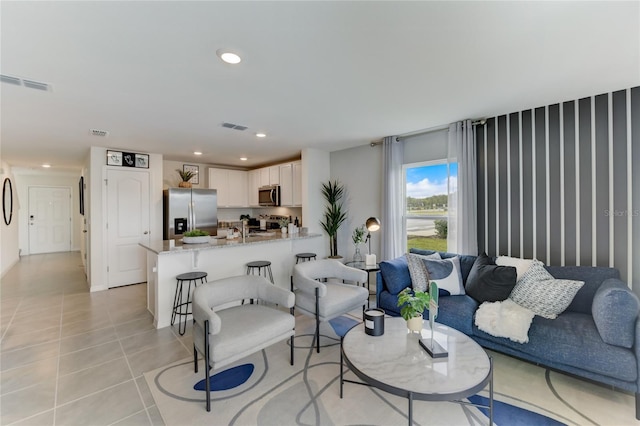 living room featuring light tile patterned floors