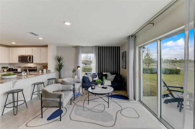 living room with light tile patterned floors