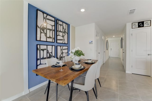 dining area with light tile patterned floors