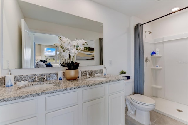 bathroom with curtained shower, tile patterned flooring, vanity, and toilet