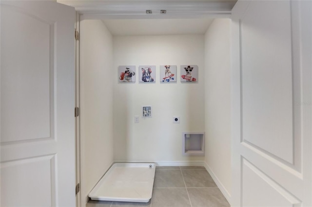 clothes washing area featuring electric dryer hookup, light tile patterned floors, and washer hookup