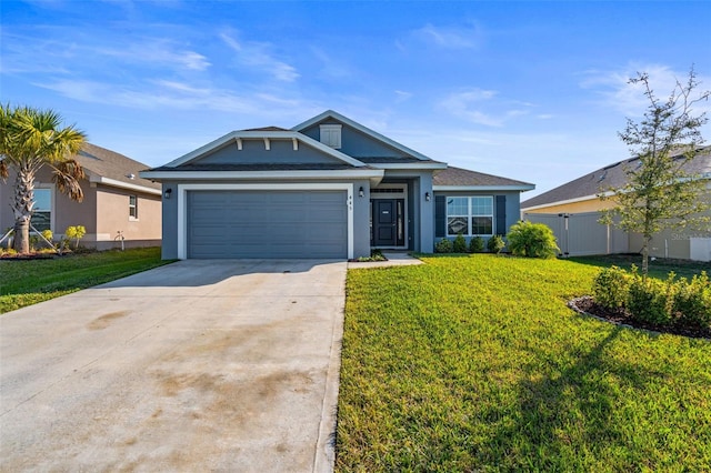 view of front facade with a front lawn and a garage