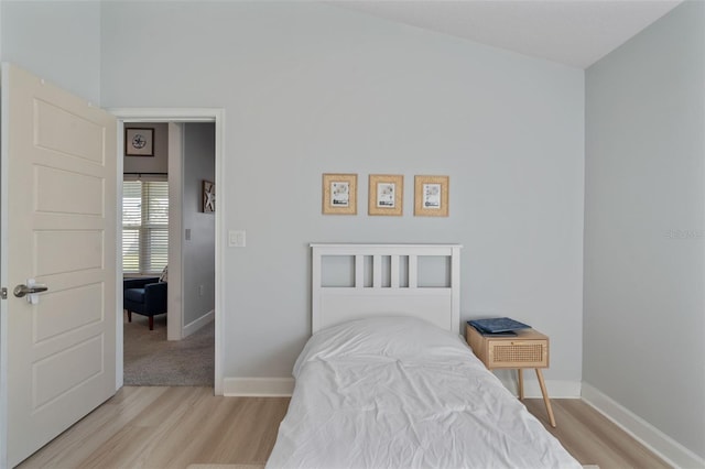 bedroom with light hardwood / wood-style flooring