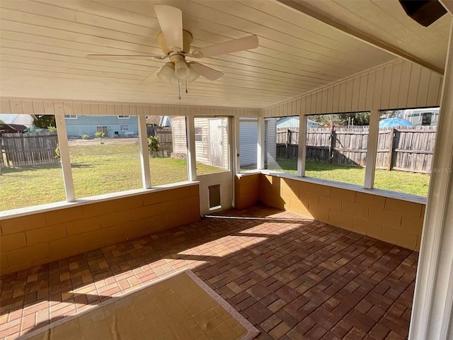 unfurnished sunroom with lofted ceiling