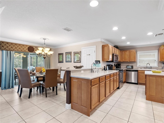 kitchen featuring stainless steel appliances, an inviting chandelier, sink, hanging light fixtures, and crown molding