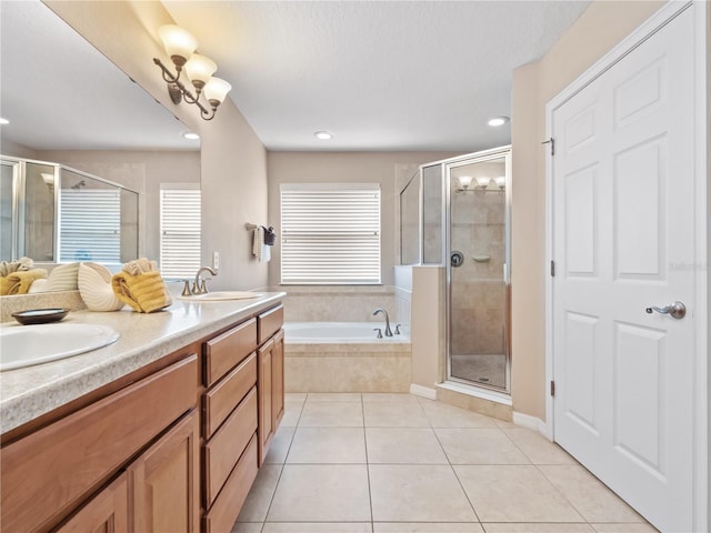 bathroom with vanity, tile patterned floors, and shower with separate bathtub