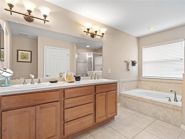 bathroom featuring vanity, tile patterned floors, and plus walk in shower