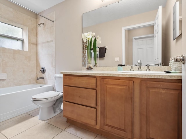 full bathroom with toilet, tiled shower / bath combo, vanity, and tile patterned floors