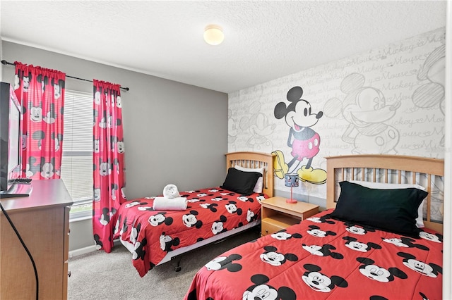 carpeted bedroom featuring a textured ceiling