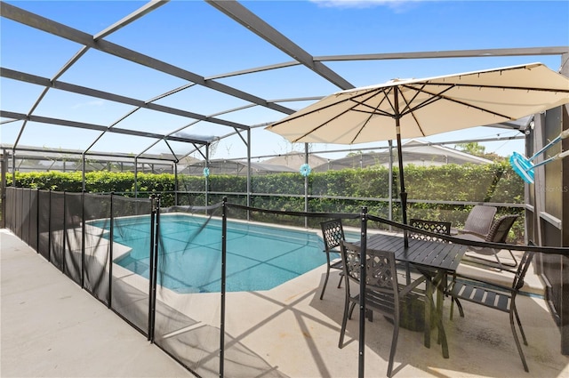 view of pool with a lanai and a patio area