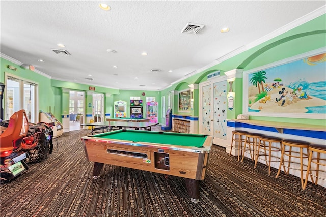 recreation room featuring a textured ceiling, billiards, and ornamental molding