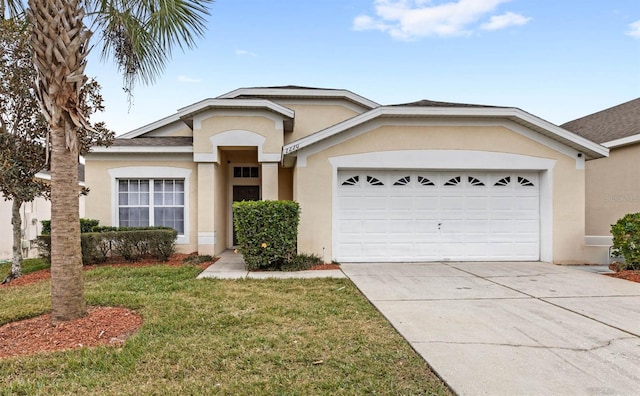 view of front of home featuring a front yard and a garage