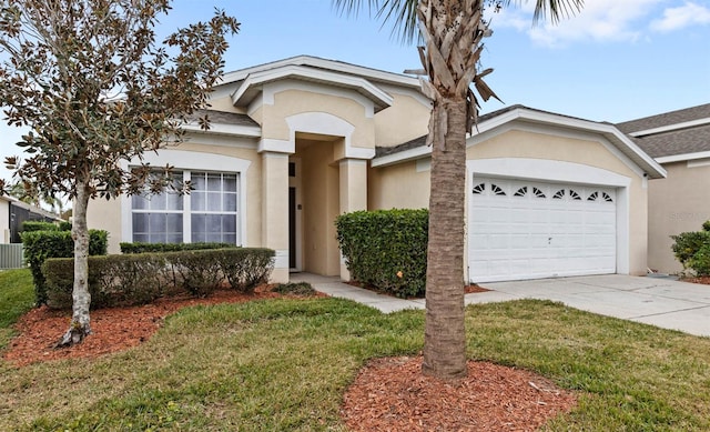 view of front of property with a front lawn and a garage