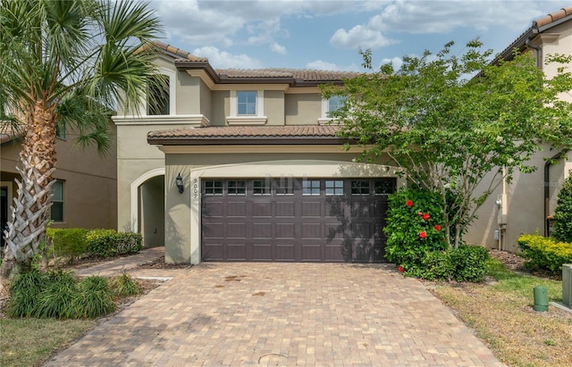 mediterranean / spanish-style home featuring a garage