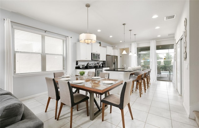 dining area with light tile patterned floors